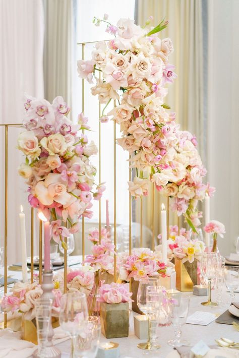 A luxurious wedding table with gold pillar floral centrepieces. These sculpted floral centrepieces include pink and white flowers by @FlowerFactoryVancouver. This wedding table designed by a Vancouver wedding planner included pink candlesticks and concrete floral vases. Save this photo if you are planning a blush pink and gold wedding. Decor: @flowerzvancouver1 Pink Cake Stand, Floral Centrepieces, Flower Factory, Tall Wedding Centerpieces, Wedding Floral Centerpieces, Blush Bridal, Wedding Set Up, Luxe Wedding, Vancouver Wedding