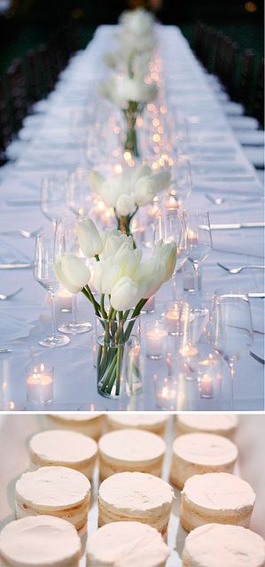 Tablecloths and white tulips accompanied by confectioners sugar-covered desserts. Wedding Table Settings Simple, Table Settings Simple, Dinner Table Settings, Candle Table Setting, White Wedding Table Setting, White Table Settings, Simple Table Settings, Tulip Wedding, Candle Lighting