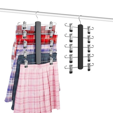 PRICES MAY VARY. Space Magic: Our skirt hangers with clips are uniquely designed to organize as many clothes as possible without taking up too much closet space, thereby saving space for other needs. Multifunctional Organization: Our skirt hangers combines clips and hooks to conveniently store a variety of clothing. You can use them to store skirts, tank tops, bras, etc., making your clothing organization more efficient and orderly. Rotatable Hooks: Equipped with rotating hooks, these skirt hang Skirt Storage, Tops Bras, Space Magic, Clothing Organization, Pants Hangers, Skirt Hangers, Hanger Clips, Pant Hangers, Storage Closet Organization