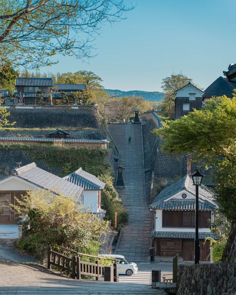 A quiet morning on the historic streets of a Japanese village, where traditional architecture meets the tranquil pace of rural life. Japanese Village, Quiet Morning, Rural Life, Traditional Architecture, Japan, Architecture