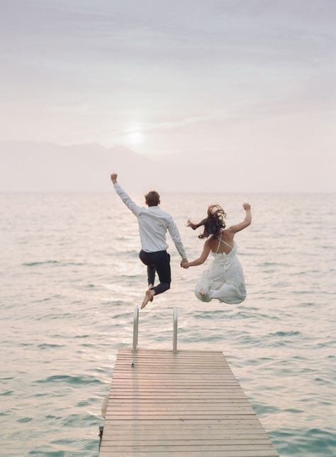 Epic Engagement Photos in Lake Tahoe Couple Jumping Off Dock in white jumpsuit || The Ganeys #epicengagement #engagementphotos #laketahoe Dock Wedding, Creative Couples Photography, Lake Photoshoot, Engagement Picture Outfits, Boat Pics, Romantic Engagement Photos, Engagement Pictures Poses, Creative Wedding Photo, Wedding Couple Photos