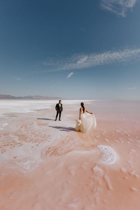 Elopement couple at the pink lake in Utah Pink Lake Utah, Utah Elopement Locations, Scenic Elopement, Wedding Picture List, Monument Valley Utah, Lake Engagement Photos, Utah Wedding Dress, Lake Photoshoot, Utah Lakes