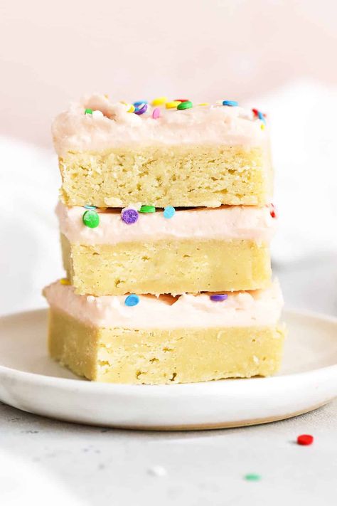 Soft, sweet, and speckled with sprinkles, these Gluten-Free Sugar Cookie Bars make for a fun treat any time! (Don't miss our favorite ways to decorate them!) / gluten free sugar cookie bars recipe / gluten-free sugar cookie bar recipe / gluten-free cookie bars / gluten-free sugar cookies / gluten-free bar cookies / gluten-free desserts / gluten-free sugar cookie bars with pink frosting / pink frosting for sugar cookies / holiday sugar cookie bars / gluten-free Christmas sugar cookie bars Christmas Sugar Cookie Bars, Sugar Cookie Bars Recipe, Gluten Free Cookie Bars, Sugar Cookie Bar Recipe, Gluten Free Holiday Cookies, Bars With Cream Cheese Frosting, Bars With Cream Cheese, Christmas Sugar Cookie, Cookies Holiday