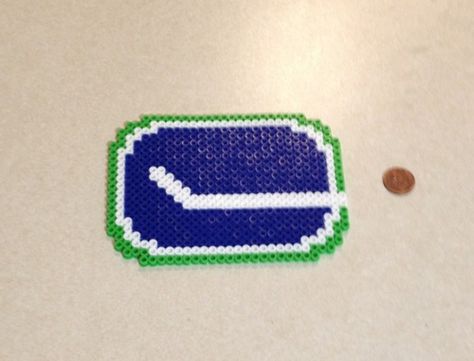 Gift for a coworker.  She’s the biggest Canucks fan I know.  Hopefully this will encourage her to stop yelling at me for cheering for ... Stop Yelling, Christmas Beads, Perler Projects, Melty Bead Patterns, Melty Beads, Bead Projects, Bead Sprite, Brick Stitch Pattern, Iron Beads