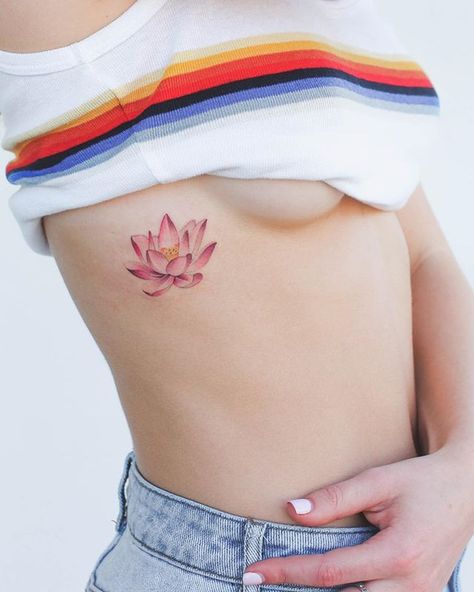 Phoenix Tattoo Girl, Flower Rib Tattoo, Pink Lotus Tattoo, Rib Cage Tattoos, Flower Tattoo On Ribs, Small Lotus Tattoo, Cage Tattoos, Iris Tattoo, Ribcage Tattoo