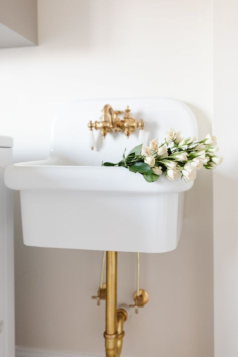 Adding a wall mount sink to a bathroom, utility space or laundry room is the ultimate way to add a touch of vintage charm. They are hard-working, space-saving and so easy on the eyes! We're sharing the pros and cons of this style of sink, as well as shopping inspiration if you're on the hunt. Whether you're looking for a modern wall mounted sink, or a ceramic wall mount farmhouse sink like ours, we've got the sources in this curated guide! Wall Mounted Utility Sink, Bathroom Utility, Exposed Plumbing, Utility Space, Wall Hung Sink, Floating Sink, Wall Mount Sinks, Painted Concrete Floors, Julie Blanner