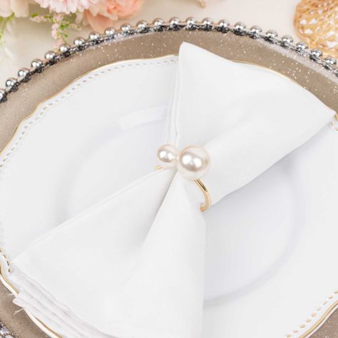 Quantity: 10 Napkin Rings Material: Metal | Plastic Color: White and Gold Style: Faux Pearls Overall Size: 1.75"W x 2.5"H Ring Size: 1.5"Dia Pearl Size: Large: 0.8"Dia. Small: 0.6"Dia Ring Thickness: 10mm Perfectly goes with our wide selection of Napkins Click Here for our Napkin Collection InformationAdditional Information: Easy to Clean: Wipe it gently with a dry or damp cloth. Uses: Perfect for home decor, wedding reception, dinner party, tea party, bridal shower, special occasions celebration, romantic candlelit banquet, holiday party decor. - 10 Pack White Pearl Gold Metal Napkin Rings Dining Table Decor, Elegant Round Wedding Holders | 2.5" by eFavormart Wedding Table Settings Blue, Candlelit Wedding Reception, Pearl Napkin Rings, Pearl Bridal Shower, Round Wedding Tables, Candlelit Wedding, Gold Napkin Rings, Napkin Rings Wedding, Metal Napkin Rings