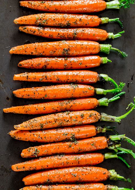 Garlic and Herb Roasted Carrots - these carrots are roasted to perfection with lots of garlic and herbs such as thyme, basil and oregano, creating the perfect side dish. Herb Roasted Carrots, Roasted Carrots Recipe, Jo Cooks, Carrot Recipes, Roasted Asparagus, Garlic Herb, Roasted Carrots, Vegetable Sides, Veggie Dishes