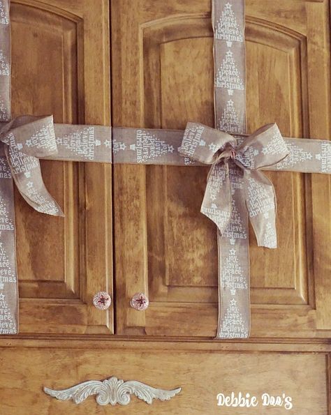 Present ribbon wrapping on cabinets for Christmas decor ideas Wrapping Cabinets, Wrap Cabinets, Wrapped Cabinets, Holiday Decor Hacks, Christmas Trees Diy, Present Ribbon, Ribbon Wrapping, Trees Diy, Diy Christmas Ornament