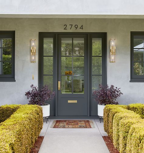 Black front door with sidelights