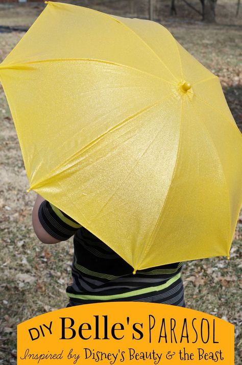 DIY Belle's Parasol - inspired by Disney's Beauty & the Beast. LOVE! I would have never thought to spray paint a white umbrella with yellow and gold glitter! Now my daughter can dress up as princess Belle any time! Diy Beauty And The Beast Party, Diy Parasol, Parasol Diy, Diy Beauty And The Beast, Gold Glitter Spray Paint, Beauty And The Beast Diy, Beauty And The Beast Dress, Shooter Recipes, Easy Diy Beauty Products