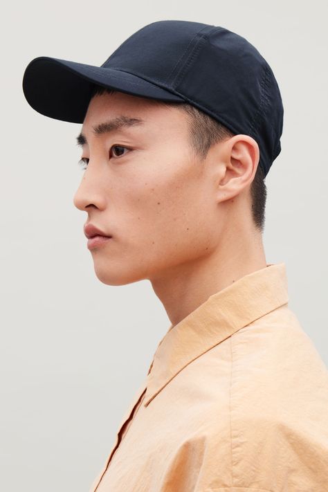 Side image of Cos baseball cap in blue Men With Cap, Male Art Reference, Mens Fashion Edgy, Male Makeup, Orphan Black, Men's Hats, Modern Wardrobe, Leather Cap, Edgy Outfits