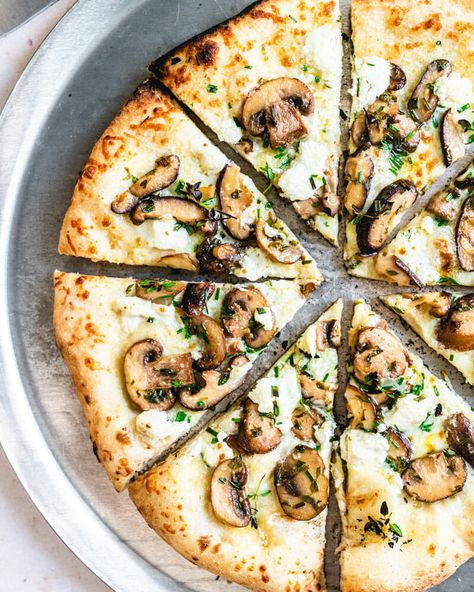 This mushroom pizza is a white pizza, so no red sauce here! It's covered with mozzarella cheese, goat cheese, and fresh herbs. Perfection! #pizza #mushrooms #mealprep #healthy #mushroom #recipe Shiitake Mushrooms Recipes, Mushroom Pizza Recipes, White Pizza Recipes, Goat Cheese Pizza, Mushroom Pizza, Artisan Pizza, White Pizza, Vegetarian Cookbook, How To Cook Mushrooms