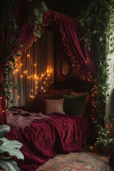 Canopy bed with sheer fabrics surrounded by burgundy velvet curtains and hanging plants. Moody Cowboy Aesthetic, Red Cottage Bedroom, Apartment Aesthetic Cozy Dark, Dark Bedroom Curtain Ideas, Dark Moody Bedroom Decor, Eclectic Aesthetic Bedroom, Eclectic Moody Bedroom, Red Bedroom Ideas Aesthetic, Bedroom Red Aesthetic