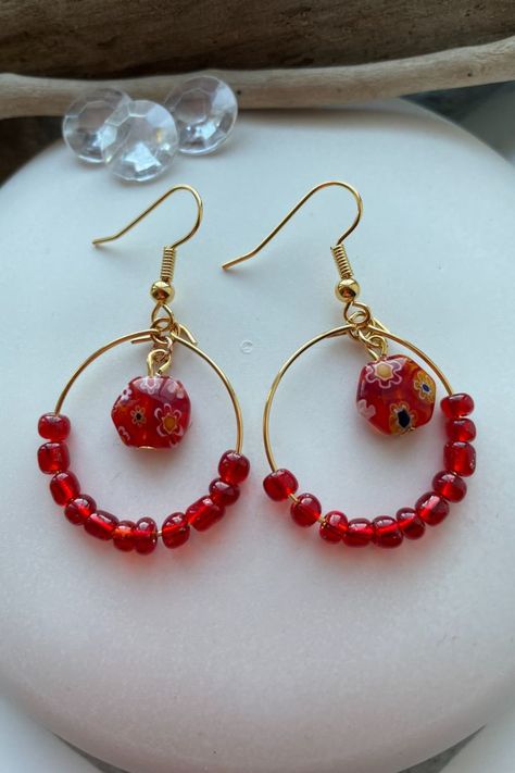 red glass bead earrings on gold hoops rest on a smooth white pebble, with a piece of driftwood and three clear crystal beads at the top of the picture. Bead Hoop Earrings, Boho Jewellery, Hoop Earrings Gold, Murano Glass Beads, Diy Crafts Jewelry, Beaded Hoop Earrings, Beaded Hoops, Dangly Earrings, Earrings Boho