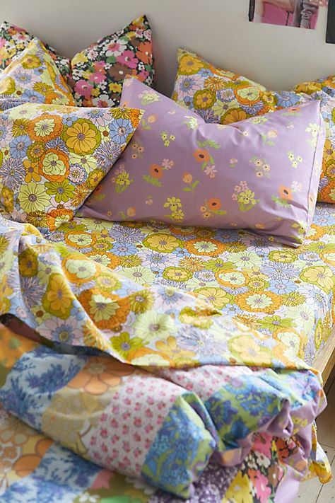 Infuse your space with vibrant pops of color when you wrap up in this patterned sheet set featuring multi-colored retro florals printed allover. Made from a seriously soft cotton-polyester blend that lends a refreshing feel to your bed. Available in sizes Twin XL, Full, Queen and King, each set includes a flat sheet, fitted sheet and pillowcases. Available exclusively at Urban Outfitters. Features Patterned sheet set from UO Home in the softest cotton-poly blend Finished with vibrant florals pri Bohemian Sheets Set, Pink And Yellow Sheets, Eclectic Bedroom Wall Decor, Things To Add To Your Bedroom, Cool Bedsheets, Colorful Dorm Room Decor, Vintage Colorful Home Decor, Urban Outfitters Bedroom Aesthetic, Mixed Pattern Bedding