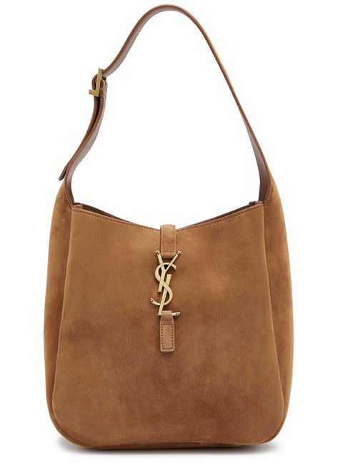 Buy from $2327.44: The Saint Laurent Le 5 à 7 bag is crafted from soft suede in a rounded hobo silhouette. This small style features an adjustable shoulder strap and the signature YSL logo plaque. The bag has an internal zip-fastening pouch and is fully lined. The bag measures 8.5 inches in width, 8 inches in height, and 3.5 inches in depth. The adjustable shoulder strap has a minimum drop of 8 inches and a maximum drop of 9 inches. The bag is perfect for housing your everyday essentials and ... Ysl Suede Bag, Ysl Hobo Bag, Ysl Hobo, Elsa Style, Suede Hobo Bag, Suede Handbag, Hand Bags For Women, Over The Shoulder Bags, Ysl Logo