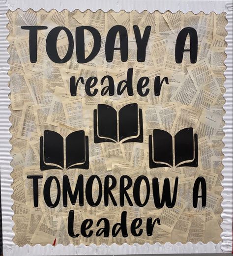 the board says Today a reader, tomorrow a leader with three book cut outs. the background is made up of pages of a book with white boarder Reading Day Placard, Reading Day Chart Ideas, Library Boards Ideas, Background For Bulletin Boards, Reading Teacher Bulletin Boards, Reading Corner Bulletin Board Ideas, Favorite Books Bulletin Board, School Themed Bulletin Boards, Readers Are Leaders Bulletin Board