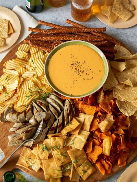 These easy crock pot dips are perfect for parties, gatherings, football games, and tailgating. Cheesy dip recipes and more! Beer Snack Board, Cheese Dip Charcuterie Board, Beer Cheese Board, Beer Cheese Charcuterie Board, Beer Board Ideas, Cheese Fondue Charcuterie Board, Beer Snacks Ideas, Beer Charcuterie Board, Oktoberfest Charcuterie Board