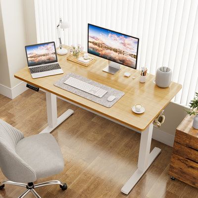 While sitting in your office desk chair may be comfortable, stretching your legs every so often is important. A standing desk can help you achieve this goal without interrupting your workflow, just push the button to raise or lower the desk. This full-sized standalone adjustable desk is a great choice for most home offices thanks to its high-quality, attractive design and easy adjustability. Besides, some research shows that standing while working helps moderate blood sugar faster following a me Desk Wood, Electric Standing Desk, Adjustable Height Standing Desk, Adjustable Standing Desk, Adjustable Height Table, Sit Stand Desk, White Desks, Office Desk Chair, Adjustable Desk