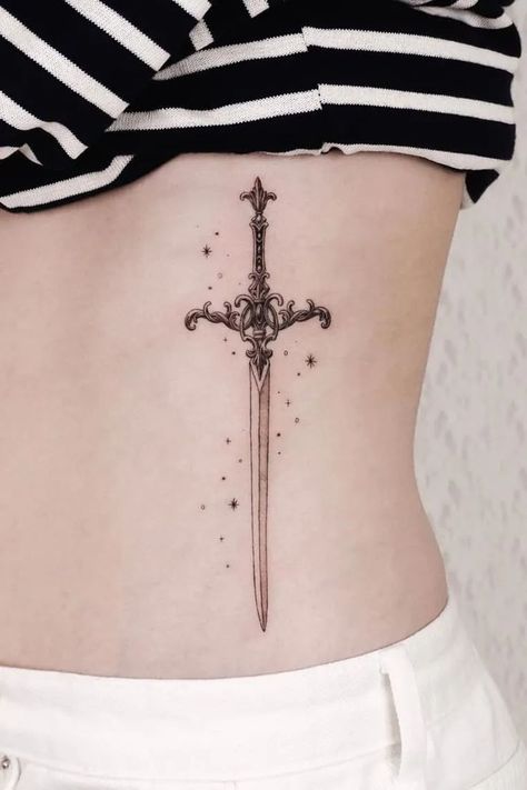 Thigh Dagger Tattoo, Excalibur Tattoo, Tattoo Ideas Underboob, Fairytale Tattoo, Neck Tattoos Women, Dagger Tattoo, Sternum Tattoo, Tattoo Design Ideas, Elegant Tattoos