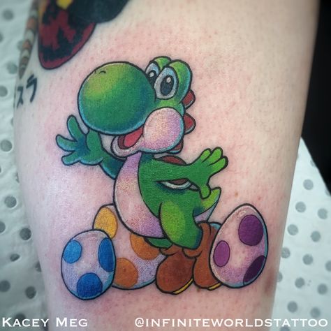 Yoshi tattoo   Tattoo by Kacey Meg from Infinite Worlds Tattoo and Design Small Yoshi Tattoo, Yoshi Tattoos, Yoshi Tattoo, Nintendo Tattoo, Mario Tattoo, Gaming Nintendo, Miami Ink, Embroidery Tattoo, Theme Tattoo