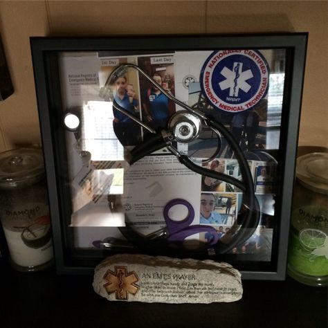 EMT shadowbox Emt Shadow Box Ideas, Ems Must Haves, Paramedic Gift Ideas, Emt Paramedic Aesthetic Female, Emt Gift Ideas, Emt Graduation Pictures, Ems Decor, Emt Aesthetic, Female Emt