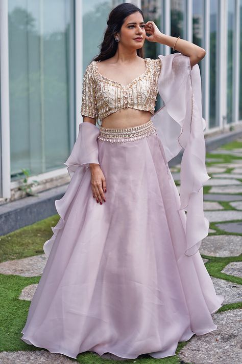 Featuring a lilac lehenga in organza base. It is paired with a matching georgette blouse having tassels hand embroidery and a ruffled dupatta.  FIT: Fitted at bust and waist. COMPOSITION: Organza, Georgette. CARE: Dry clean only. Lilac Lehenga, Ruffle Dupatta, Blouse Lehenga, Crop Top Lehenga, Simple Lehenga, Organza Lehenga, Wedding Lehenga Designs, Lehenga Designs Simple, Lehenga Blouse Designs