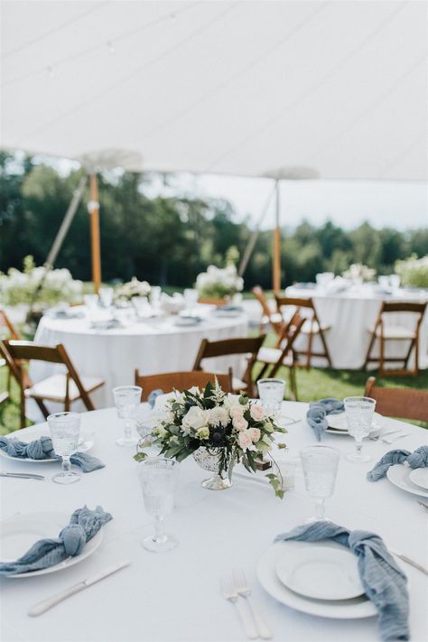 Minimalist Wedding Table Design Inspiration | Dusty Blue Gauze Napkins with Blush and White Floral Centerpieces in a silver compote Slate Blue Wedding Centerpieces, Wedding Table Decorations Light Blue, Dusty Blue And White Wedding Table Settings, White Dusty Blue Wedding, Slate Blue Table Setting Wedding, Dusty Blue Candle Centerpieces, Stone Blue Wedding, Dusty Blue And Silver Table Setting, White And Dusty Blue Table Setting