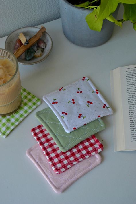 Cherries, gingham, pink, and green! Handmade and special to order. Comes in a set of 4 coasters. Fabric Coasters Tutorial, Sewing Patchwork Ideas, Sew Coasters Diy, Sewing Projects Home Decor, Things To Make With Sewing Machine, Sewed Christmas Gifts, Sew Coaster, Easy Sew Gifts, Coasters To Sew