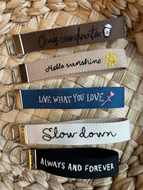 5” diameter wristlets with stainless steel keychain clip. Hand embroidered quote in each of them, with different fonts and some also include art ♥️ #embroidery #embroideryart #embroideryartist #embroideryartist #embroidered #wristlet #keychain #wrist #wristband #customised #customgifts #customized #giftideas #gift #giftsforfriends #giftsforfriends #gifts Embroidered Wristlet Keychain, Embroidery Keychain Diy, Keychain Wrist, Sewing Inspiration Projects, Embroidered Keychains, Homemade Essential Oil, Simple Stitch, Convention Gifts, Small Business Packaging Ideas