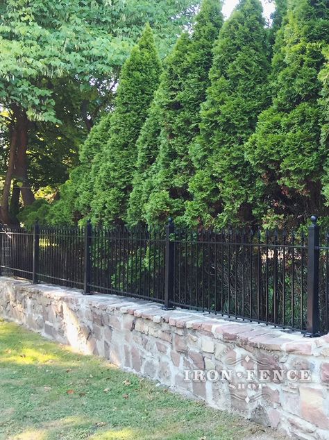 Retaining Wall With Fence, Stone Fence Ideas, Aluminum Fence Landscaping, Aluminum Fence Ideas, Rod Iron Fences, Cast Iron Fence, Fence Wall Design, Exterior Materials, Estate Gates