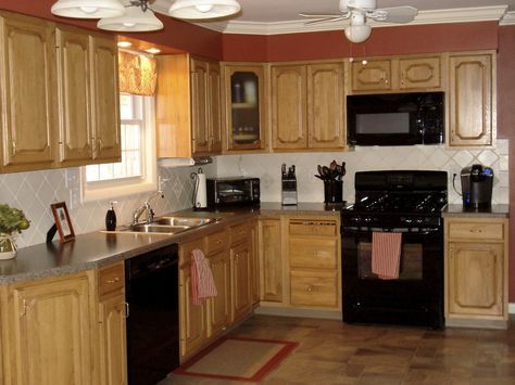 kitchens with black appliances photos | The matching black appliances made a huge impact in my opinion. Pine Kitchen Cabinets, Affordable Kitchen Cabinets, Black Appliances Kitchen, Trendy Kitchen Colors, Painting Oak Cabinets, Pine Kitchen, Black Appliances, Oak Kitchen Cabinets, Kitchen Black