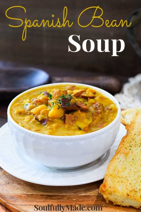 Spanish Bean Soup (Garbanzo Bean Soup) takes you on a trip to Tampa Bay, where Cuban heritage is so alive & full of flavor. This simple soup is made with garbanzo beans, potatoes & savory sausage and is just bursting with deliciousness! #SpanishBeanSoup #GarbanzoBeanSoup #ChickPeaSoup #SpanishFood #SpanishSoup Spanish Bean Soup Recipe, Spanish Bean Soup, Garbanzo Bean Soup, Spanish Beans, Garbanzo Bean Recipes, Spanish Soup, Beans Potatoes, Cuban Heritage, Simple Soup