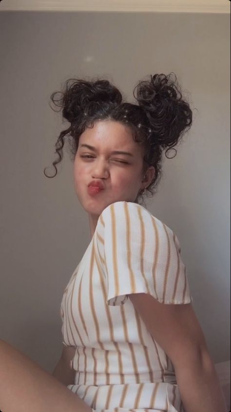 Curly hairstyle Cute Curly Space Buns, Curly Double Buns, Curly Buns Hairstyle, Two Buns Curly Hair, Braided Curly Bun, Curly Low Bun Hairstyles, Curly Hair Space Buns, Space Buns Curly Hair, Artsy Hairstyle