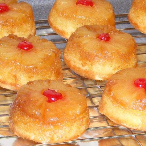 Pineapple Upside Down Cupcakes | "Oh these came out wonderfully. I used my larger muffin pans to make single serving cakes so there was more pineapple at the top of the cakes. I would recommend this recipe to all." Pineapple Upside Down Cakes, Upside Down Cupcakes, Cake Boss Recipes, Upside Down Cakes, Muffin Top Pan, Muffin Pan Recipes, Pineapple Upside Down Cupcakes, Single Serve Cake, Single Serve Desserts