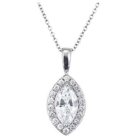 .70ct Marquise diamond with a simple halo of round diamonds, set in platinum on a 16 inch chain. Crafted in the Peter Suchy workshop. EGL certified. 1 Marquise diamond, approx. total weight .70cts, I – J, SI3, EGL certificate # US312297801D 18 round full cut diamonds, approx. total weight .18cts, H, VS Platinum 16 inch chain Top to bottom: 19.91mm or .98 inch with bail Top to bottom: 14.06mm or .55 inch without bail Width: .35mm or 8.93 inch Depth: 3.55mm 1.8 grams Marquise Necklace Settings, Timeless Silver Marquise Diamond Necklace, White Gold Marquise Platinum Necklace, Dazzling Marquise White Gold Necklace, Dazzling White Gold Marquise Necklace, Fine Jewelry Marquise Platinum Necklace, Dazzling Marquise Diamond White Necklace, Silver Marquise Diamond Necklace, Marquise Platinum Necklace Fine Jewelry