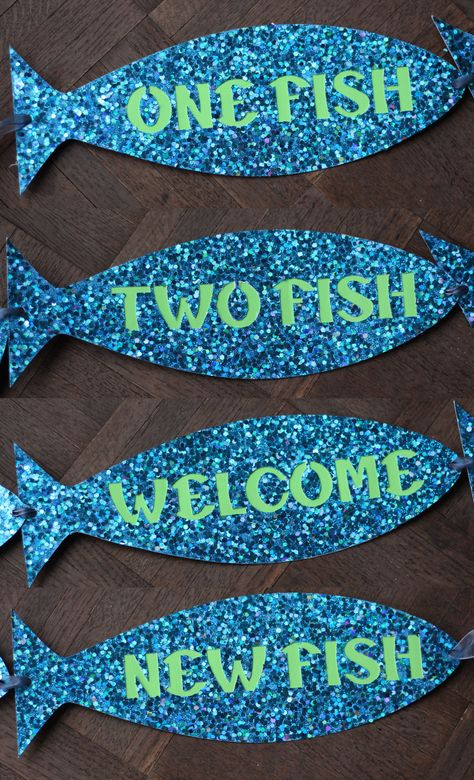 One Fish, Two Fish, Welcome New Fish! Decorate your fish-themed, ocean-themed, or beach-themed baby shower with this sparkling banner. Order the finished product or the SVG file to make it yourself! #theluckylionboutique #babyshowerdecor #oceantheme #fishingtheme #drseuss #beachtheme #nauticaltheme #babyshowerbanner #welcomebaby Fish Theme Baby Shower Ideas, Shark Themed Baby Shower Ideas, Shark Baby Shower Theme, Ocean Themed Baby Shower Boy, Fish Baby Shower Ideas, Ocean Theme Baby Shower Ideas Boy, Fish Themed Baby Shower Ideas, Fish Baby Shower Theme, Shark Baby Shower Ideas