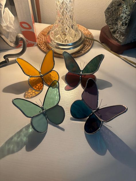 These gorgeous glass butterflies are handmade to order! Little legs are carefully soldered to allow these beautiful bugs to sit gracefully on any windowsill, shelf, desktop, table, or wherever you need a little pop of color.  Please reach out if specific glass is wanted! Otherwise, I will carefully select the glass that I think will look nicely together to complete your butterfly 🦋 Stained Glass Sculpture, Windowsill Shelf, Butterfly Stained Glass, Glass Butterflies, Diy Stained Glass Window, Desktop Table, Stained Glass Night Lights, Butterfly Candles, L'art Du Vitrail