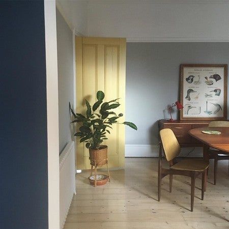 Dining room painted in Pavilion Grey, with woodwork and ceiling/coving in All White. Dining room door in Sudbury Yellow. Glimpse of kitchen wall painted in Hague Blue. Pavilion Grey, Bathroom Grey, Gray Bathroom Accessories, Edwardian House, Yellow Doors, Grey Furniture, Brown Walls, Trendy Bathroom, Blue Bathroom