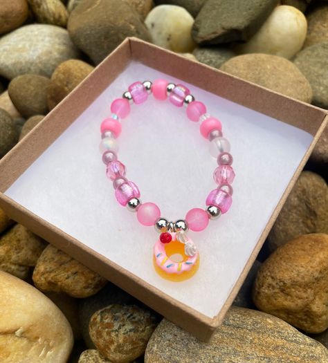 This yummy Pink Donut Treasure Charm Bracelet is looking for a home and is available now for DM Sale - please read below for details ✨🩷🍩👩🏽‍🍳 Donut Treasure Charm Bracelet: $15 includes a Free DreamyMoodFoods Pin & Extra Surprises ✨ Please send me a DM to claim ✨🩷🍩 #dreamymoodfoods #foodcharms #beadbuddies #donutbracelets #handmadejewelry #charmbracelets #donutcharms #diyjewelry #donutlovers Pink Donut, Food Charms, Pink Donuts, Send Me, Diy Jewelry, Handmade Jewelry, Charm Bracelet, Bracelet, Beads