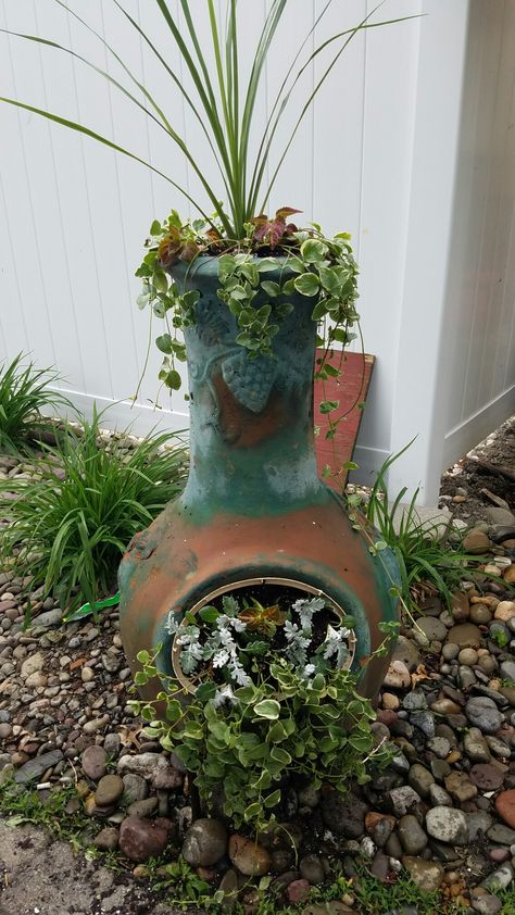 Retired chiminea! Makes a great yard decoration when it becomes too old to burn in it! Repurposed Chiminea Ideas, Repurpose Chiminea Ideas, Chiminea Planter Ideas, Chiminea Planter, Chiminea Ideas, Chimnea Outdoor, Clay Chiminea, Upcycled Planters, Planter Arrangements