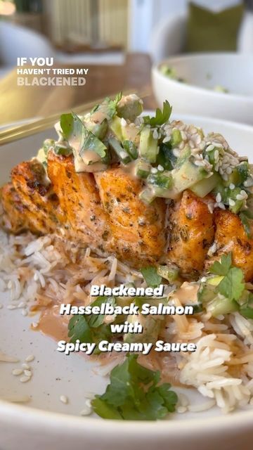 Sarah Thomas on Instagram: "If you haven’t tried my Blackened Hasselback Salmon with Spicy Creamy Sauce you’re totally missing out! ⬇️ . . . . This recipe is a fun twist on a spicy salmon roll and it’s one of the most popular recipes on my website! If you don’t have an air fryer, don’t worry. You can bake the salmon in the oven for 12-15 minutes at 400! Let me know if you give this recipe a try! Google Search “Healthyish blackened Hasselback salmon” or click the link in my bio to grab the full recipe. #salmon #spicysalmon #sushi #salmonroll #spicysalmonroll #salmonrecipe #airfryer #spicyfood #easyrecipes #dinner" Blackened Hasselback Salmon, Healthyish Blackened Hasselback Salmon, Air Fryer Spicy Hasselback Salmon, Spicy Hasselback Salmon, Hasselback Salmon, December Meals, College Dinner, Salmon In The Oven, Blackened Salmon Recipes