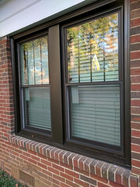 Bronze double hung windows with vertical grids in top sashes and bronze aluminum capping around the outside. Dark Bronze Windows Exterior, Brown Aluminium Windows, House Exterior Windows, Bronze Windows Exterior, Brown Windows, Black Vinyl Windows, Windows House, Metal Window Frames, Harvey House