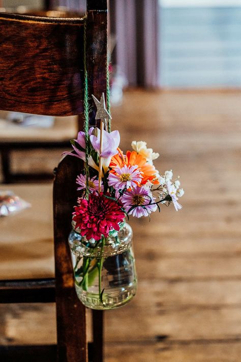 Wildflower Wedding Chairs, End Of Aisle Wedding Flowers, Pew Flowers For Wedding, Chair Flowers Wedding, Ceremony Flowers Aisle, Kitsch Wedding, Chair Flowers, Sophie Grace, Jar Flowers