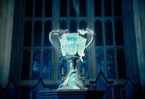 Triwizard Trophy - The Cup was made not later than 1294, date when the earliest known Triwizard Tournament took place. Ever since its creation, the Cup has been held by the victorious school until the next Tournament took place. The Goblet Of Fire, Goblet Of Fire, Harry Potter, Glass, Silver, Blue