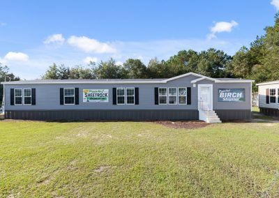 Highlander 4 Bed/3 Bath 2,254 sq ft | West Gate Home Center Double Wide Exterior Makeover, Trailer Skirting Ideas, Doublewide Mobile Home Renovations, Triple Wide Modular Homes, Mobile Home Addition, Triple Wide Mobile Homes, Double Wide Trailer, Best Modular Homes, Mobile Home Front Porch