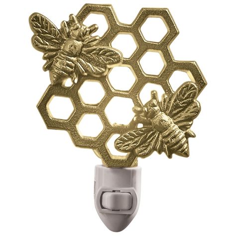 Beautiful buzzing bees gleam with the honeycomb design in a glorious golden finish for a chic display that delightfully illuminates a room space with a sense of nature. Place this decorative plug-in light in a variety of interior styles and room choices like a hallway, bedroom, entryway or bathroom space. Simply position within the desired outlet and flip the manual switch to activate a comfortable lighting accent within your spring farmhouse or summer home decor. A 5-Watt bulb is included, prov Bee Bedroom, Seasonal Room Decor, Seasonal Room, Bathroom Night Light, Bee Nursery, Entryway Stairs, Busy Bees, Honeycomb Design, Night Light Lamp