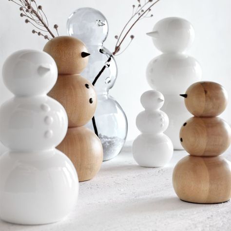 Our modern and minimalist take on a winter icon, this clear glass snowman delights with artisan quality and plenty of personality. Skilled craftspeople polish the hand-blown glass figure, adding coal-inspired buttons and a carrot-like nose by hand. Charming on its own or filled with faux snow, the large snowy friend looks particularly perfect outfitted with twig arms—just thread gathered sticks through the holes in the side of the vase.     Hand-blown and -polished  Borosilicate glass  Dust with White And Navy Christmas Decor, Simple White Christmas Decor, Crate And Barrel Christmas Decor, Industrial Christmas Decorations, White Christmas Home Decor, Crate And Barrel Christmas, 2024 Holidays, Winter Kitchen Decor, Cozy Holiday Decor