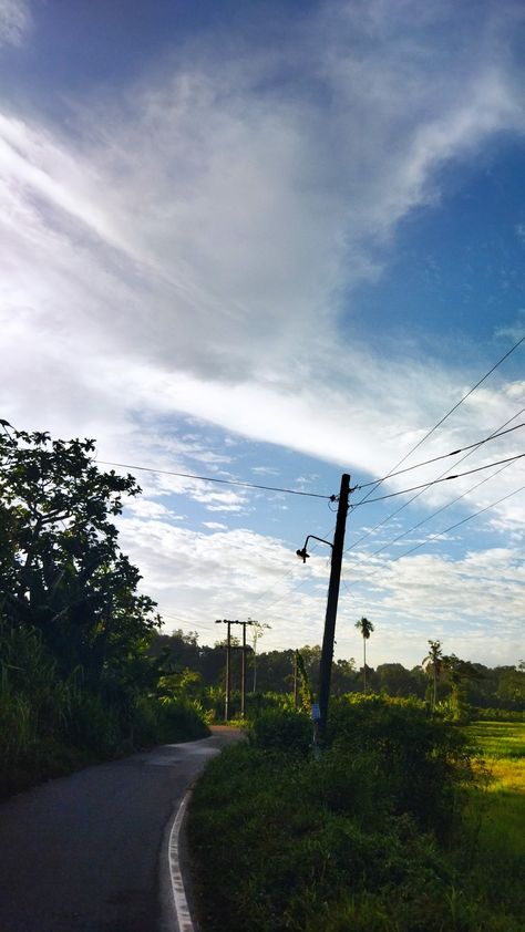 Village road, paddy field , sky Village Photography Nature Hd, Farm Village Aesthetic, Village Snap, Village Pic, Village Vibes, Farm Light, Countryside Village, Farm Village, Insta Reels